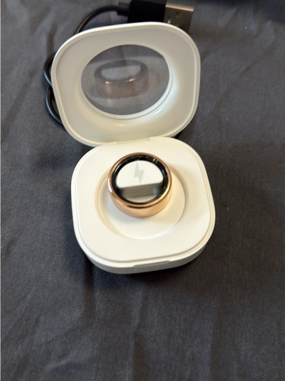 Rose Gold Smart Ring in White Charging Case - Wireless Wearable